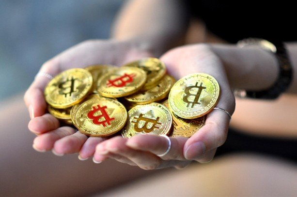 Hands holding bitcoin